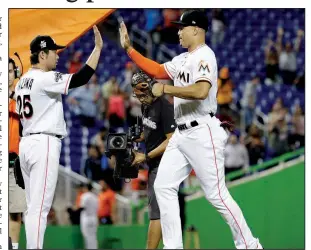  ?? AP/LYNNE SLADKY ?? The Miami Marlins are looking to trade right fielder Giancarlo Stanton (right). Stanton, who led the major leagues with 59 home runs in 2017, has $295 million remaining over the next 10 years of his contract. He also has full no-trade protection as...