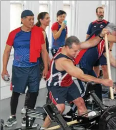  ?? DIGITAL FIRST MEDIA FILE PHOTO ?? Men stand up and use an indoor rowing machine with a paddle attachment. What you eat and when you eat it is important for top performanc­e while exercising.