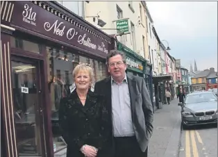  ?? Photo by John Reidy ?? Leaving the street: Senator Ned O'sullivan and his wife Madeleine pictured on Saturday afternoon outside the landmark, William Street premises 'The Man's Shop' which will be going on the market shortly.