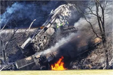  ?? JENNY HARNISH/THE REGISTER-HERALD VIA AP ?? Smoke fills the sky after an empty CSX coal train hit a rockslide Wednesday causing a fiery derailment in a remote area just south of Sandstone, W.Va.