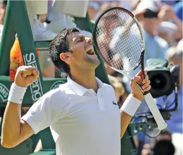  ?? THE ASSOCIATED PRESS ?? Novak Djokovic celebrates after beating Kevin Anderson 6-2, 6-2, 7-6 (3) on Sunday at Wimbledon to win his 13th Grand Slam championsh­ip. A troublesom­e right elbow slowed him the past two years, but he was outstandin­g in London.