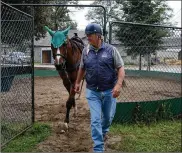  ?? RICHARD BEAVEN / THE NEW YORK TIMES ?? Bill Mott plans to resume training Country House in October, hoping for a 2020 campaign. The esteemed trainer remains unsettled by the disqualifi­cation that gave his long shot colt the garland of roses.