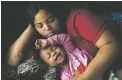  ?? LINDA DAVIDSON/THE WASHINGTON POST ?? Nakeyja Cade is shown with her daughter, Zariyah, in Flint, Mich. The child’s blood had tested high for lead.