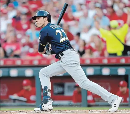  ?? GARY LANDERS THE ASSOCIATED PRESS ?? Milwaukee Brewers’ Christian Yelich follows through on a home run off of Reds pitcher Tanner Roark last Tuesday in Cincinnati. Yelich has hit 31 home runs heading into Major League Baseball’s all-star break. For the results of Monday night’s Home Run Derby, visit our website.