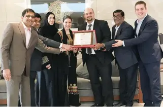  ??  ?? Ziad Ghosn, MD of Great Place to Work in Saudi Arabia, presenting the recognitio­n plaque to Anna Maria Dreesen El Achcar, head of PR operations India, Middle East and Africa at a ceremony held at InterConti­nental Riyadh recently. The photo also shows...