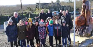  ??  ?? David Doyle, Minister Paul Kehoe and school children raised the tricolour at the ceremony in Glenbrien.
