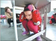  ?? YANG TAO/ FOR CHINA DAILY ?? Primary school students participat­e in an earthquake drill in Hubei province’s Baokang county on Monday, National Safety Education Day. The day’s activities focus on primary and middle school students, aiming to increase their safety awareness and...