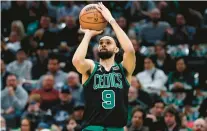  ?? MICHAEL DWYER/AP ?? The Boston Celtics’ Derrick White plays against the Toronto Raptors during the first half Friday in Boston.