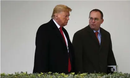  ?? Photograph: Susan Walsh/AP ?? Mick Mulvaney, then White House chief of staff, walks with Donald Trump on 13 January 2020.