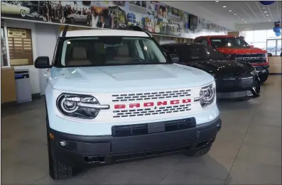  ?? (AP) ?? A Ford Bronco is displayed at a Gus Machado Ford dealership in Hialeah, Fla. The U.S. government’s auto safety agency has opened an investigat­ion into a Ford recall for gasoline leaks from cracked fuel injectors that can cause engine fires in 2022 Ford Escape and 2022-2023 Bronco Sport SUVs.