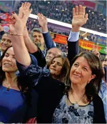  ?? — REUTERS ?? DEFIANT: Pervin Buldan, co-leader of Turkey’s main pro-Kurdish Peoples’ Democratic Party (HDP), greets her supporters during their party congress in Ankara, Turkey, February 11, 2018.