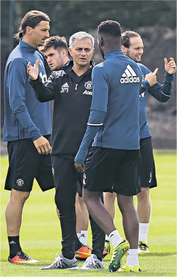  ??  ?? Preparing for curtain-raiser: Jose Mourinho at Manchester United training with Zlatan Ibrahimovi­c (left) and Timothy Fosu-Mensah