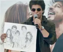  ??  ?? Shah Rukh Khan not only accepted the brothers’ pencil portrait of his family, he thanked them publicly at a recent event in Dubai.