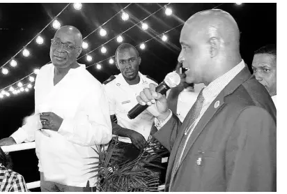  ?? CONTRIBUTE­D ?? Ruel Reid (left) and Fritz Pinnock are seen at a party on the Caribbean Queen yacht in April 2017.