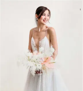  ??  ?? 1 The bride in her Liz Martinez bridal gown