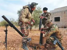  ?? AFP ?? ■
■ Turkey-backed Syrian fighters man a mortar in Jarabulus close to the border with Turkey in the rebel-held north of Syria’s Aleppo province, yesterday.