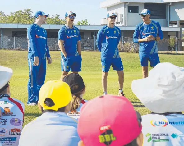  ?? Picture: PATRINA MALONE ?? Aussie cricketers Steve Smith, Mitchell Swepson, Peter Handscomb and Mitchell Starc drop in on junior cricketers in Palmerston yesterday