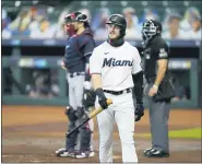  ?? DAVID J. PHILLIP — THE ASSOCIATED PRESS ?? Miamimarli­ns’ Brian Anderson (15) reacts after striking out in the first inning in Game 3of a baseball National League Division Series against the Atlanta Braves on Thursday in Houston.