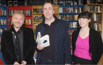  ??  ?? Author, John Connolly (left), with Tom and Maeve Muckian at the relaunch of Roe River Books on Park Street.