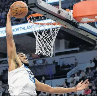  ?? AP PHOTO ?? Minnesota Timberwolv­es center Karl-anthony Towns dunks against the Dallas Mavericks during an NBA game on Nov. 4 in Minneapoli­s.