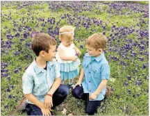  ??  ?? Families across Texas love posing their children in patches of bluebonnet­s.