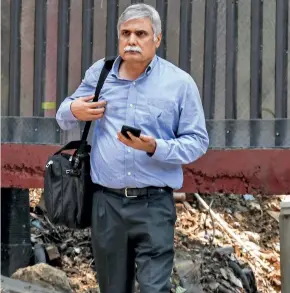  ?? ?? SUMMONED (Left) Former NSE MD Chitra Ramakrishn­a, in black shawl, at the CBI HQ in March; above, Sanjay Pandey at the ED office in Delhi on July 19