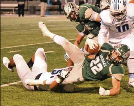  ?? PAUL DICICCO — FOR THE NEWS-HERALD ?? Lake Catholic’s Nate Rieple fights for yards against Benedictin­e on Oct. 13 at Jerome T. Osborne Sr. Stadium.