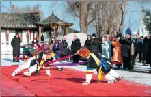  ?? ZHANG BIAO / FOR CHINA DAILY ?? Villagers preform a traditiona­l Korean dance for visitors during a folk festival in Bailong on Jan 5.