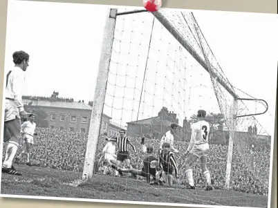  ?? ?? Bobby Moncur (centre left) opens the scoring against Ujpest Dozsa, with some getting a roof-top view