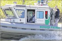  ?? NATHAN LAMBRECHT / THE MONITOR ?? Rep. Michael McCaul (center), R-Austin, rides in a U.S. Customs and Border Protection boat on the Rio Grande south of Mission on Wednesday. McCaul and Speaker of the House Paul Ryan toured the Texas border with Mexico by air and boat.