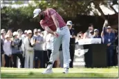  ?? RYAN KANG — THE ASSOCIATED PRESS ?? Jon Rahm hits from the 11th tee during the final round of the Genesis Invitation­al at Riviera Country Club on Feb. 19 in the Pacific Palisades area of Los Angeles.