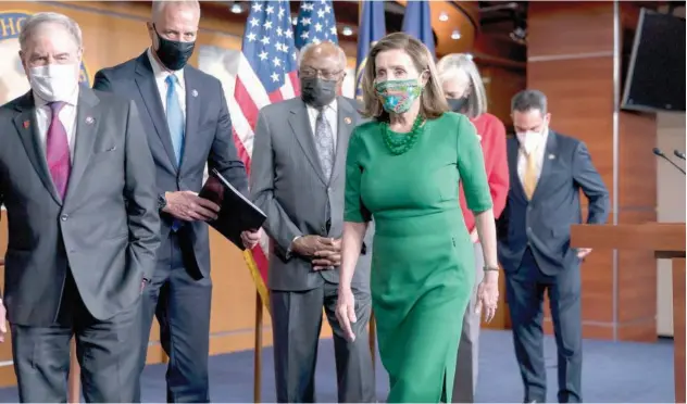  ?? Associated Press ?? ↑
Nancy Pelosi wraps up a news conference prior to the House vote at the Capitol in Washington on Friday.