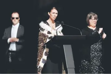  ??  ?? Ardern speaks during the national remembranc­e service for victims of the mosque attacks at Hagley Park in Christchur­ch, New Zealand. — Reuters photo