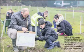  ??  ?? Pupils at Newlands Primary School in Earl Shilton planted woodlands to celebrate the opening of its new school site.