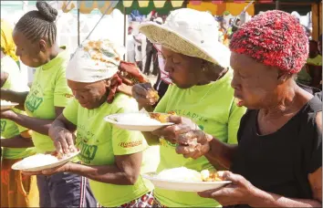  ??  ?? Elderly women participat­e in a sadza-eating competitio­n during a family fun day organised by First Lady Auxilia Mnangagwa in Mabvuku, Harare, on Saturday. — (Picture by John Manzongo)