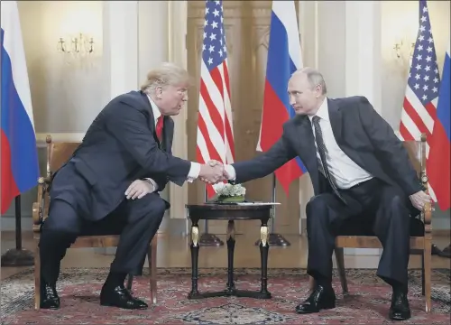  ?? PICTURE: AP PHOTO/PABLO MARTINEZ MONSIVAIS. ?? President Donald Trump, left, and Vladimir Putin shake hands at the beginning of a meeting at the Presidenti­al Palace in Helsinki, Finland. GESTURE: