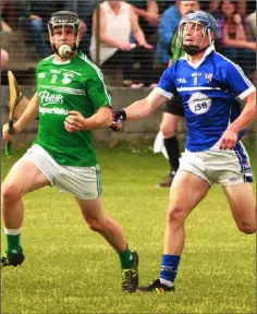  ??  ?? Peter Travers of Naomh Eanna in control as Oylegate-Glenbrien attacker Seamus Casey moves in.