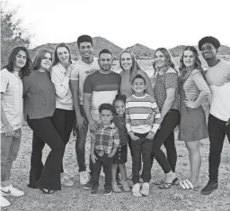  ?? COURTESY OF BECERRA FAMILY ?? Nicole and Jesus Becerra (center) pose with their 10 children. In addition, the Becerras have fostered children over the last five years.