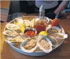  ??  ?? Fresh oysters with house-made sauces are a signature item at Sailor Oyster Bar.