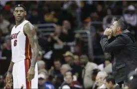  ?? TONY DEJAK, FILE — THE ASSOCIATED PRESS ?? In this file photo, a Cleveland Cavaliers fan yells at Miami Heat forward LeBron James (6) during the first quarter of an NBA basketball game in Cleveland.