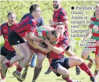  ?? Picture: RICHARD BIRCH ?? Pwllheli’s Osian Jones is caught by two Llangefni tackles