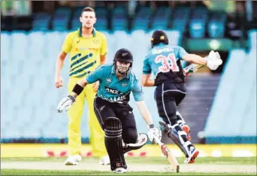  ?? AFP ?? New Zealand batsmen run between the wickets during a test match with Australia.