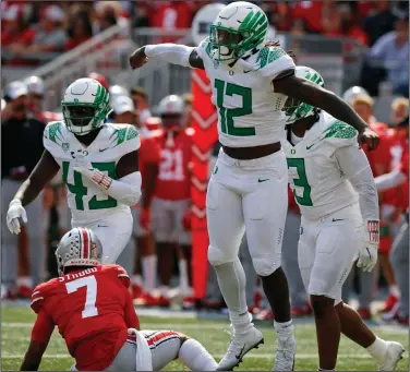  ?? (AP/Jay LaPrete) ?? Oregon defensive end DJ Johnson celebrates his sack of Ohio State quarterbac­k C.J. Stroud on the final play of the game Saturday at Ohio Stadium in Columbus, Ohio. The No. 12 Ducks won 35-28, handing the No. 3 Buckeyes their first regular-season loss since October 2018 at Purdue.