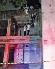  ?? RESCUE THAILAND CLUB FACEBOOK ?? Rescuers retrieve two bodies at an abandoned Phuket hotel where a father hanged his 11-month-old daughter and then himself, following a quarrel with his wife. He broadcast the suicide live on Facebook.