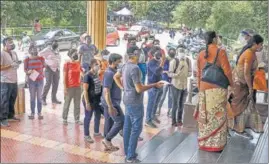  ??  ?? Beneficiar­ies queue up to get vaccinated, at a hospital in Bengaluru on Tuesday.