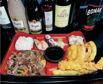 ?? Photos by Mike Sutter/Staff ?? Godai Sushi Bar & Japanese Restaurant: A bento box lunch special with beef teriyaki, nigiri, tuna roll, crab salad and tempura is among the items on the eight-page menu.