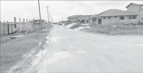  ??  ?? Lowtie Atwaroo’s body was submerged in a drain along this street in Plantation Walk, Herstellin­g, New Housing Scheme