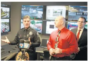  ?? WAYNE K. ROUSTAN/STAFF ?? Hollywood Police Chief Frank Fernandez, left, explains how the new Crime Intelligen­ce Center works at a news conference at police headquarte­rs.