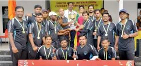  ??  ?? Members of the Food Corporatio­n of India Andhra Pradesh region side pose with their trophies alongside former athlete Shiny Wilson after defending their title in the FCI South Zone Inter Regional cricket tournament in Kochi. The team from AP beat Tamil Nadu in the final.