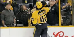  ?? The Associated Press ?? STICK TO IT: Nashville center Ryan Johansen throws his stick into the crowd after the Predators’ 2-1 victory over the Anaheim Ducks in Game 3 of the NHL Western Conference finals Tuesday night. Nashville, leading the best-of-seven series 2-1, is home...